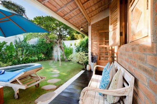 Shaded Sofa Overlooking The Pool