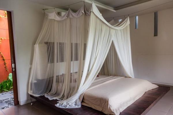 Bed With Mosquito Net In The Bedroom