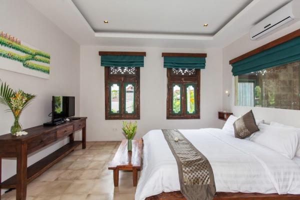 Flower Arrangement, TV And AC Facilities In Bedroom