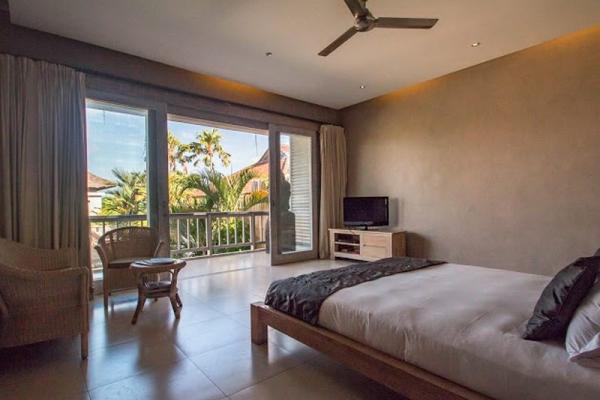 TV And Rattan Sofa In The Bedroom