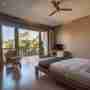 TV And Rattan Sofa In The Bedroom