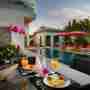 Dining Table Overlooking The Pool Area