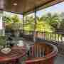 Chairs And Table With Flowers At The Balcony